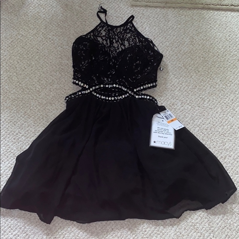 NWT beautiful black lace dress with side cutouts